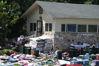 Mattresses, clothing and campers' trunks are seen outside cabins at Camp Mystic on July 8